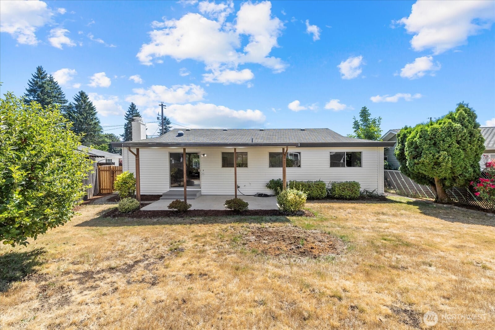 16531 120th Avenue Southeast Renton, WA 98058 - Photo 21 of 25 a view of a house with backyard sitting area and porch