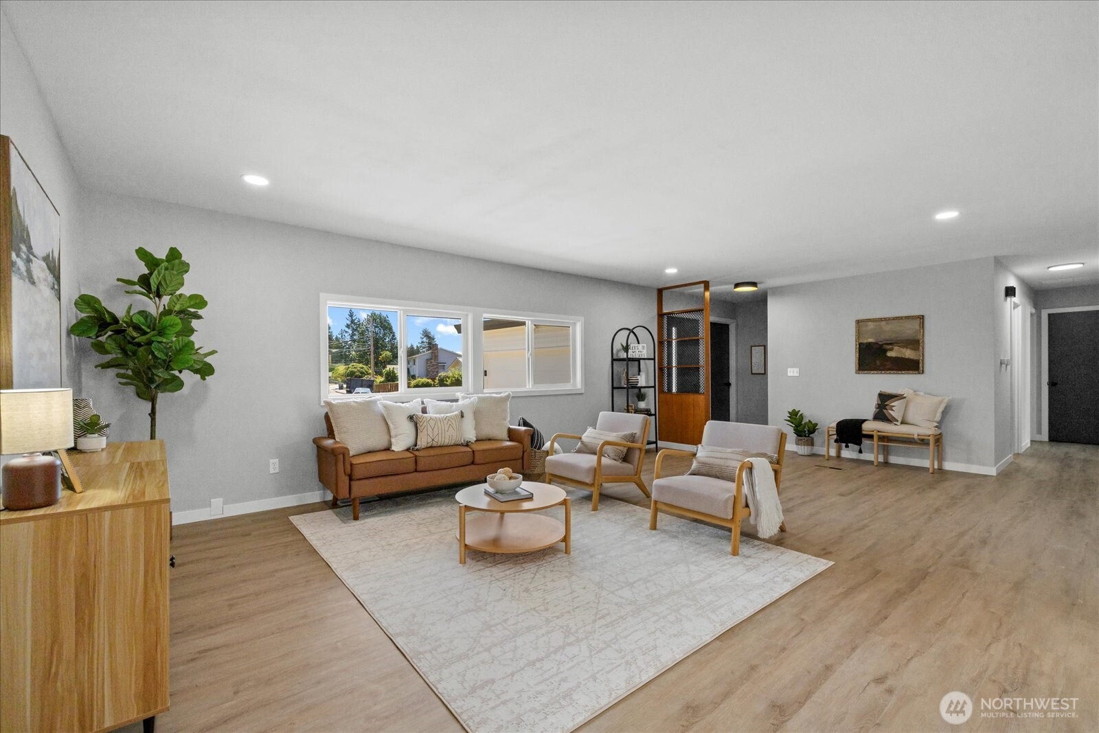 16531 120th Avenue Southeast Renton, WA 98058 - Photo 3 of 26 a living room with furniture and a large window