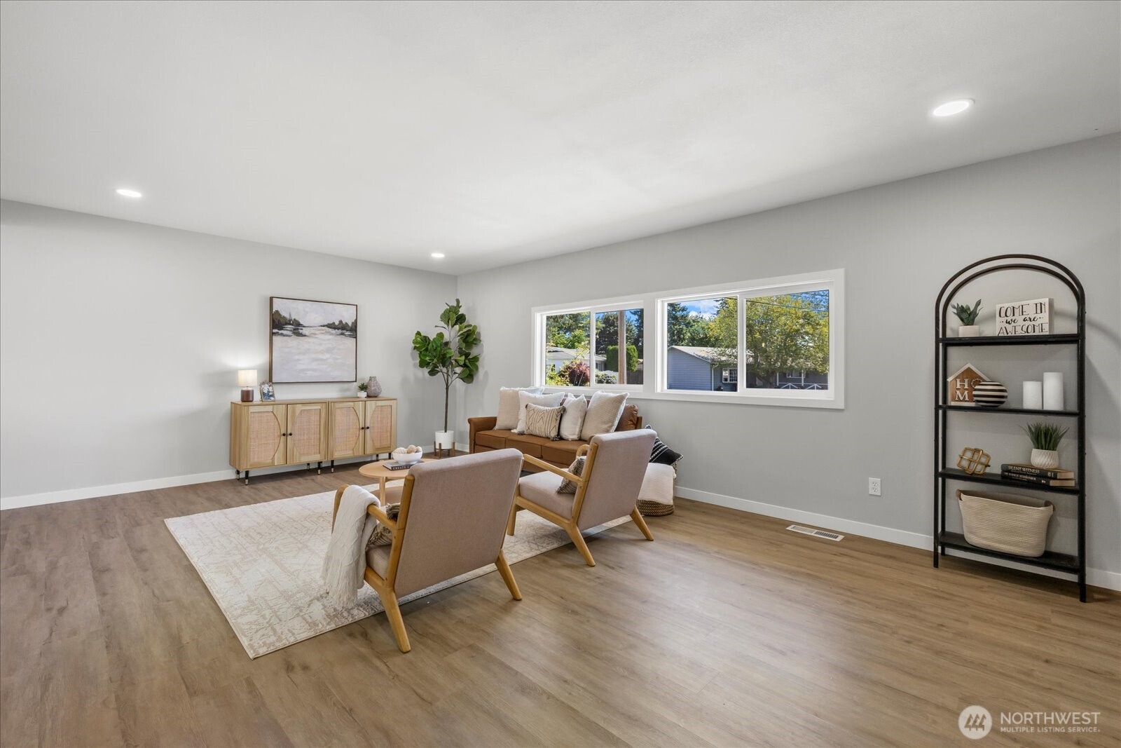 16531 120th Avenue Southeast Renton, WA 98058 - Photo 5 of 26 a living room with furniture and wooden floor