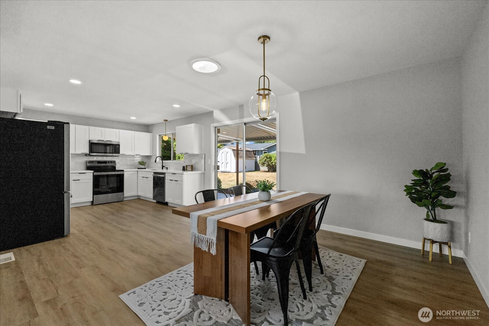 16531 120th Avenue Southeast Renton, WA 98058 - Photo 8 of 25 a view of a dining room with furniture