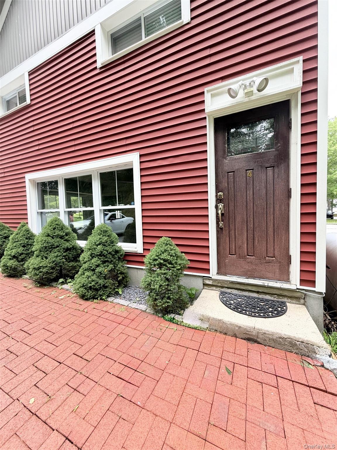 4 Lower Trinity Pass Road Pound Ridge, NY 10576 - Photo 2 of 29 a front view of a house with a yard