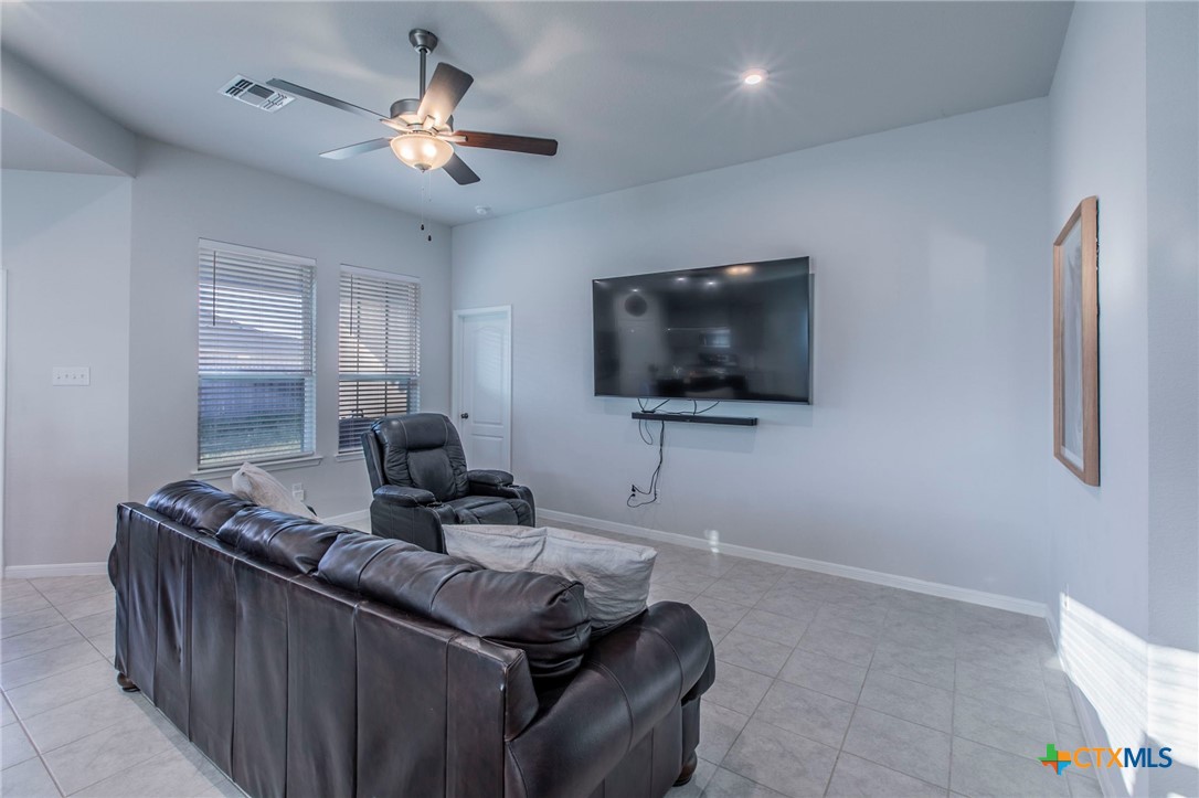 908 Coriander Road Temple, TX 76501 - Photo 5 of 28 a living room with furniture and a flat screen tv