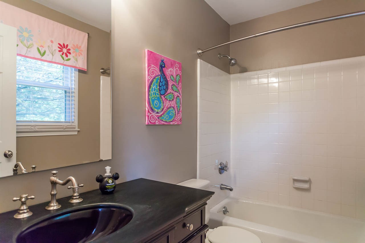 3145 Merrianne Drive Raleigh, NC 27607 - Photo 19 of 25 This ensuite bath for Bedroom #2 offers a new bath vanity , new bath hardware and lighting, and a tub/shower combination. Full Bath #2