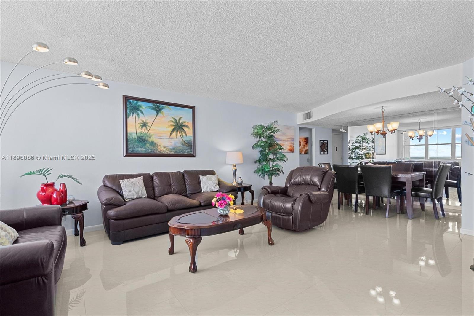 2101 South Ocean Drive, Unit 905 Hollywood, FL 33019 - Photo 14 of 38 a living room with furniture and a chandelier