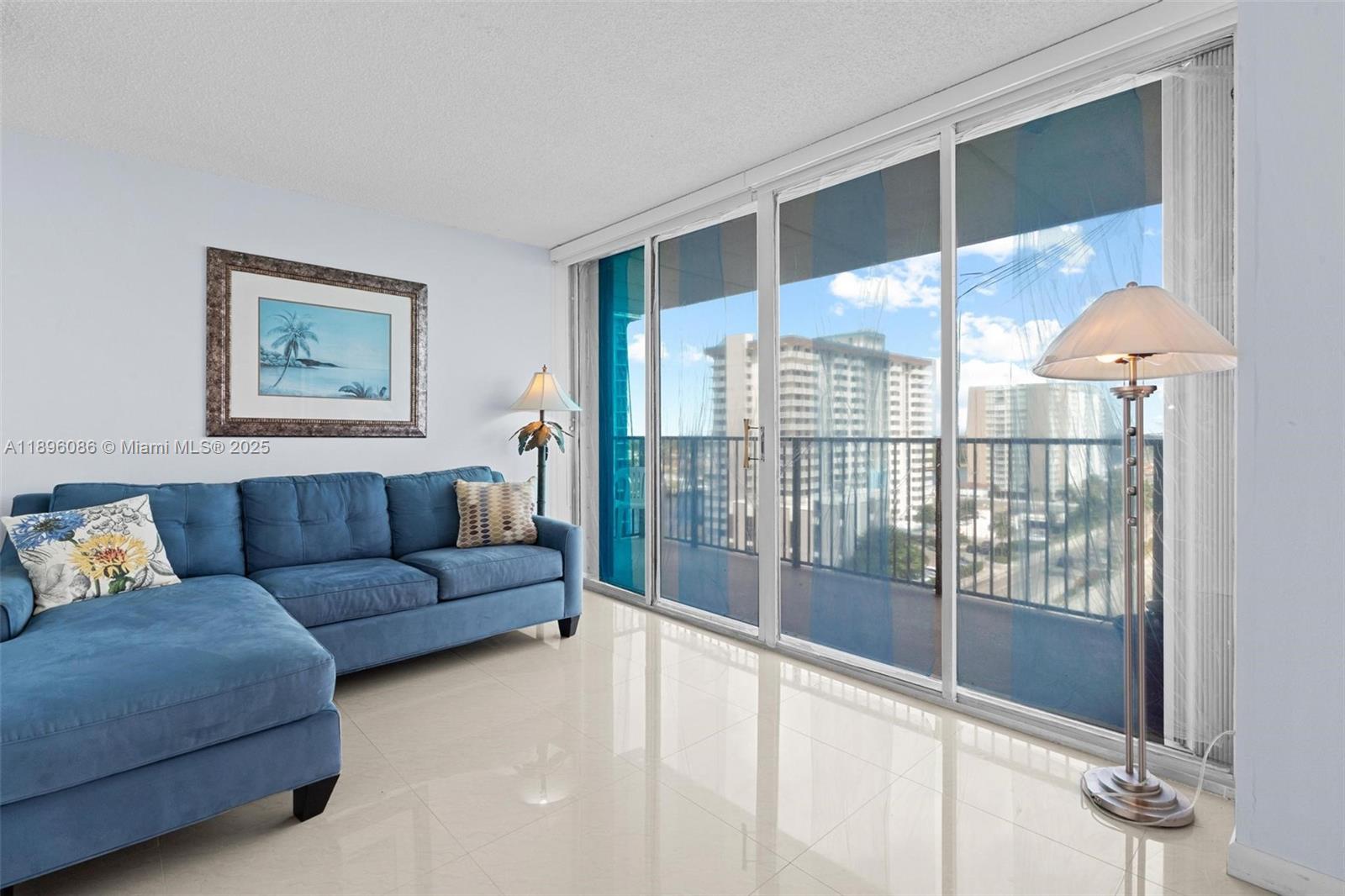 2101 South Ocean Drive, Unit 905 Hollywood, FL 33019 - Photo 16 of 38 a living room with furniture and a large window