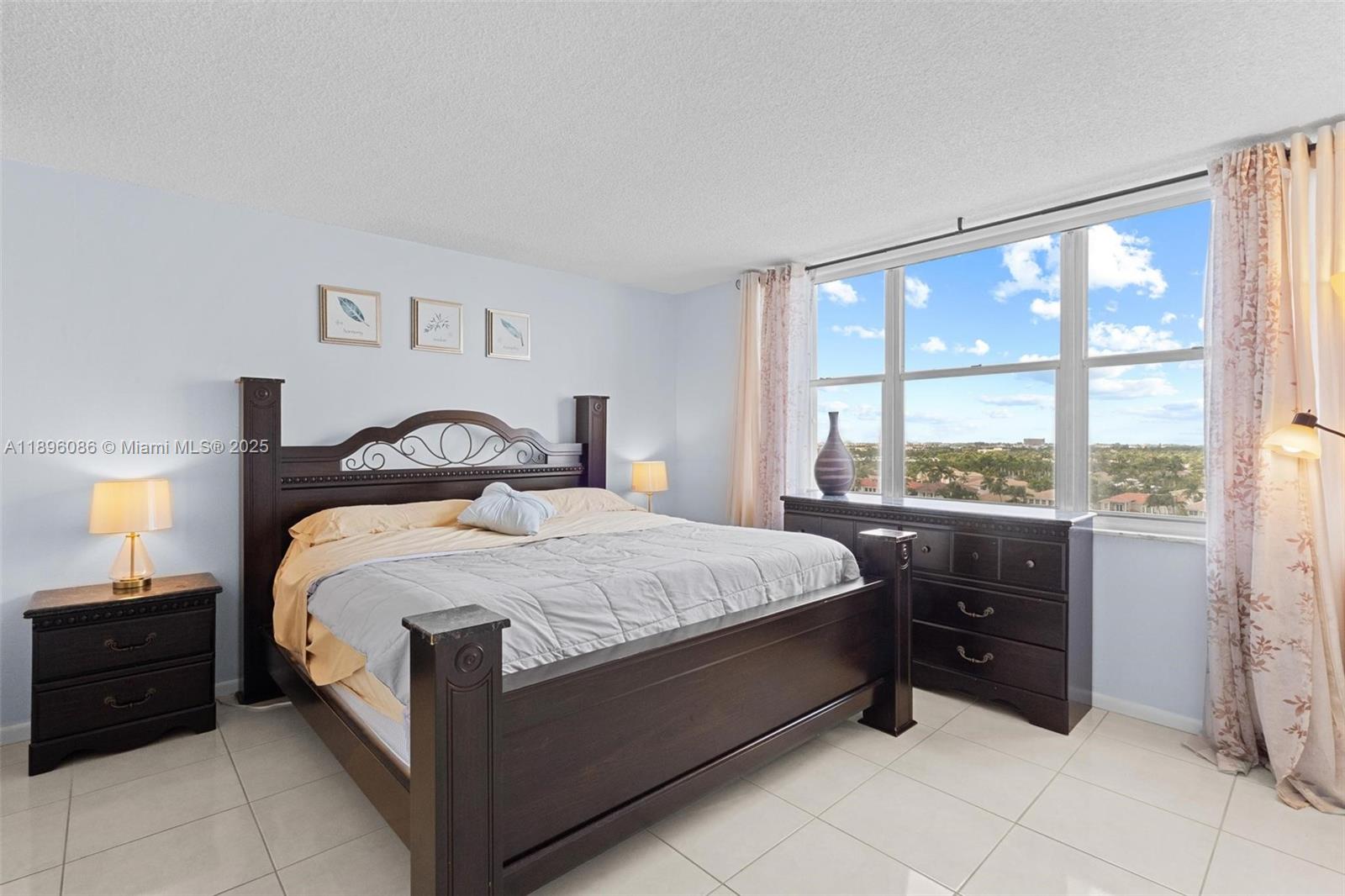 2101 South Ocean Drive, Unit 905 Hollywood, FL 33019 - Photo 20 of 38 a bedroom with a bed and a window