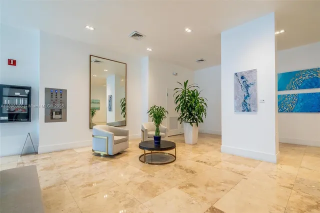 a view of a living room and a potted plant