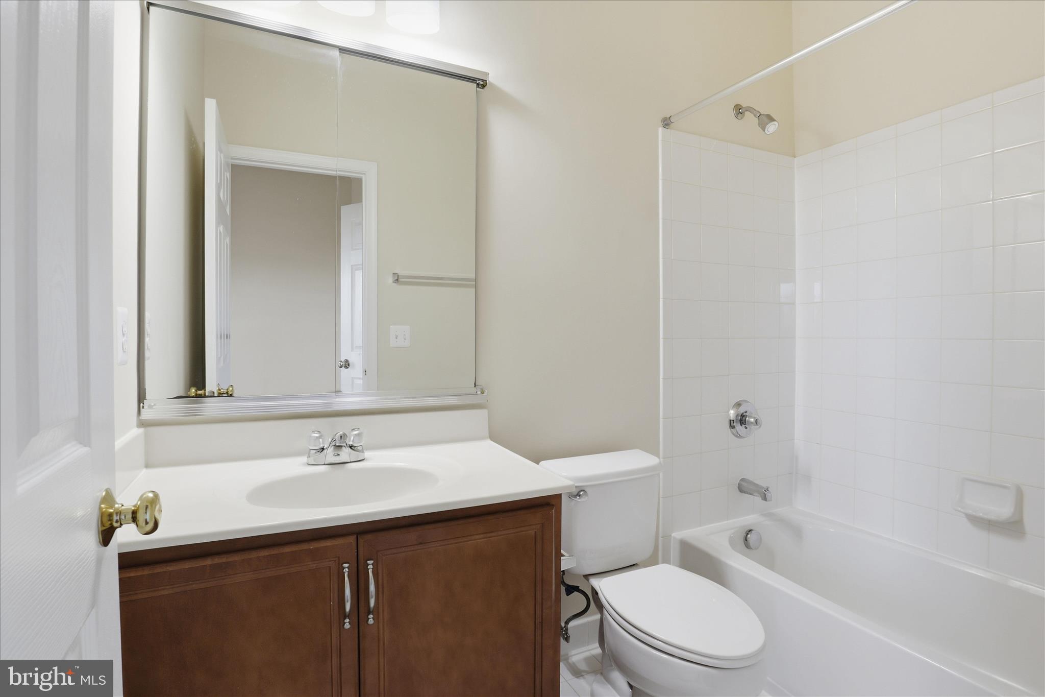 20432 Homeland Terrace Ashburn, VA 20147 - Photo 29 of 43 a bathroom with a sink toilet vanity and shower