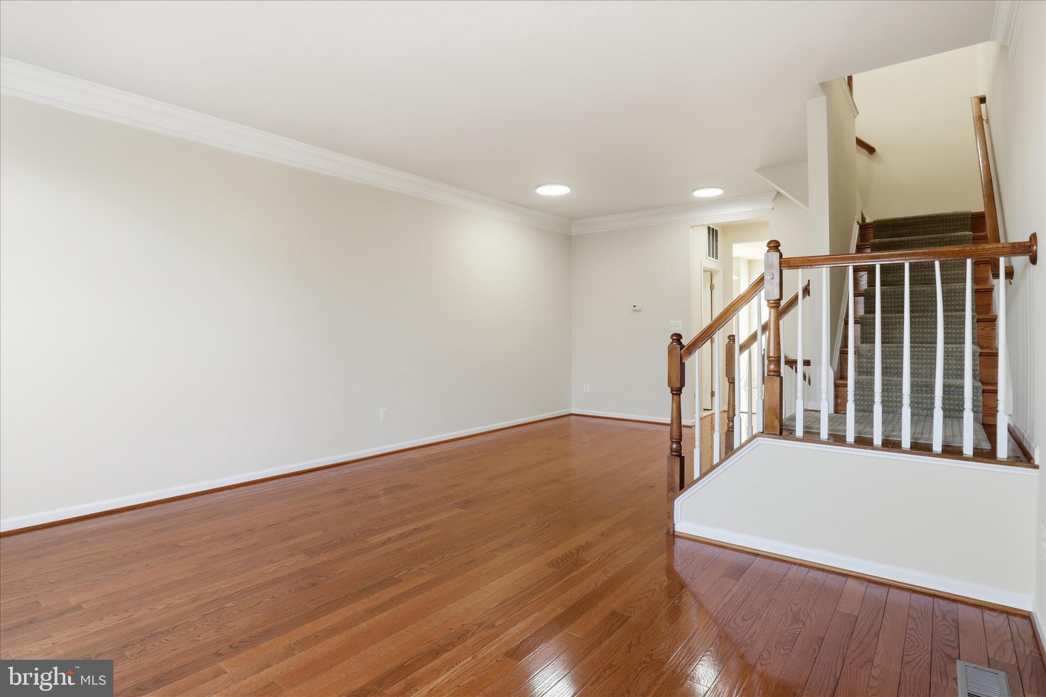 20432 Homeland Terrace Ashburn, VA 20147 - Photo 10 of 43 a view of an empty room with wooden floor
