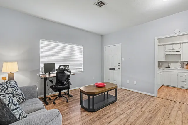 a living room with furniture and a table