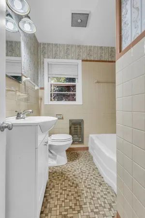 a bathroom with a white tub and a shower curtain