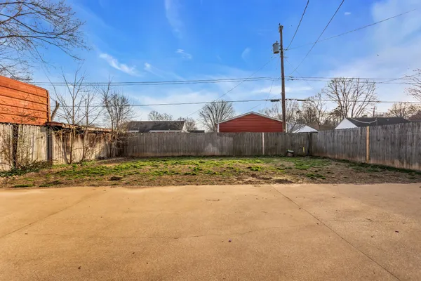 a front view of a house with outdoor seating