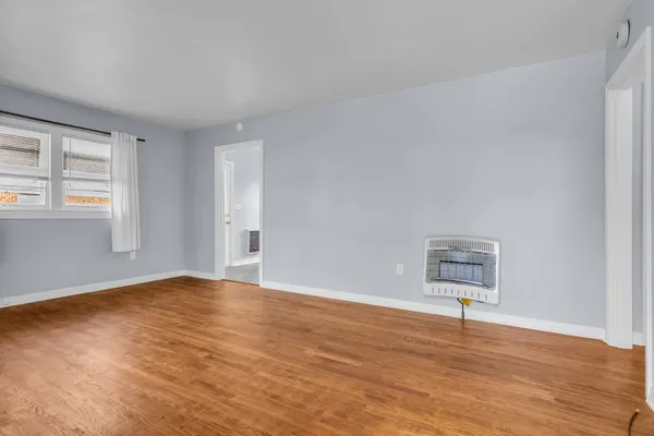 a view of an empty room and window