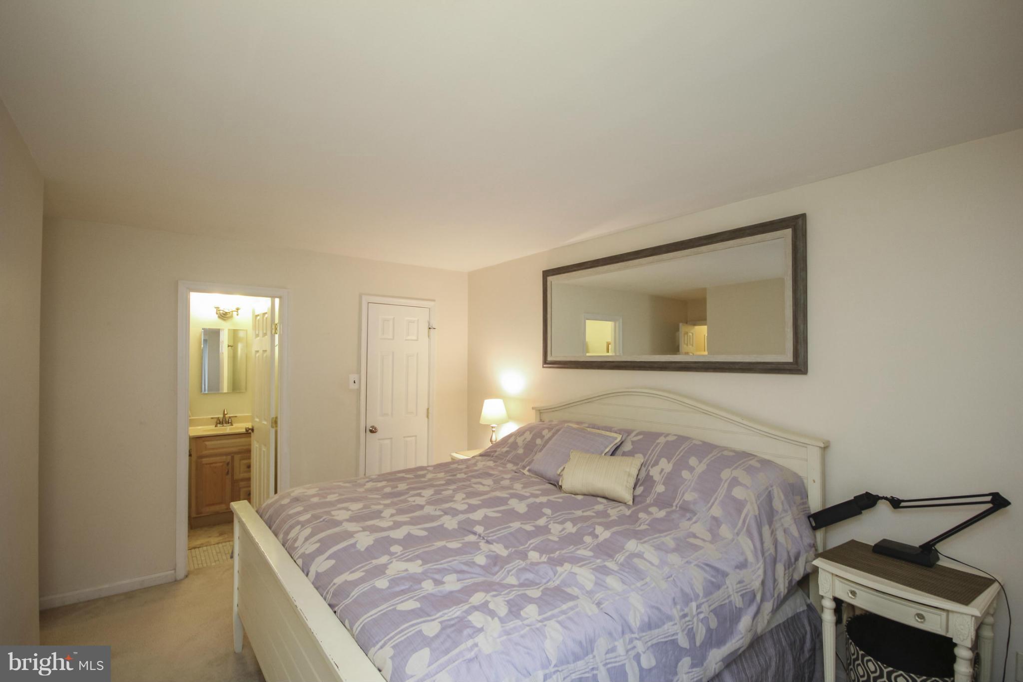 6155 Edsall Road, Unit 6155 Alexandria, VA 22304 - Photo 15 of 29 a bedroom with a bed and a painting on the wall