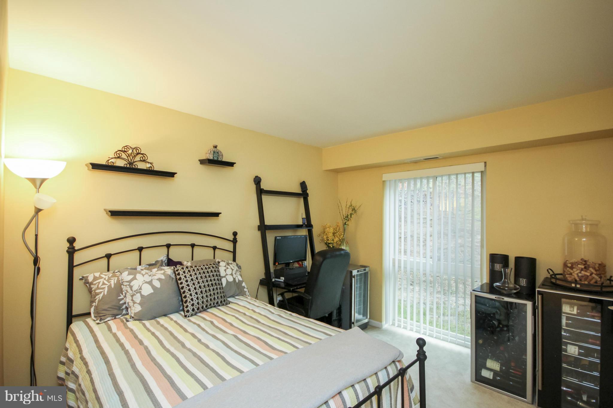 6155 Edsall Road, Unit 6155 Alexandria, VA 22304 - Photo 18 of 29 a bedroom with a bed and wooden floor