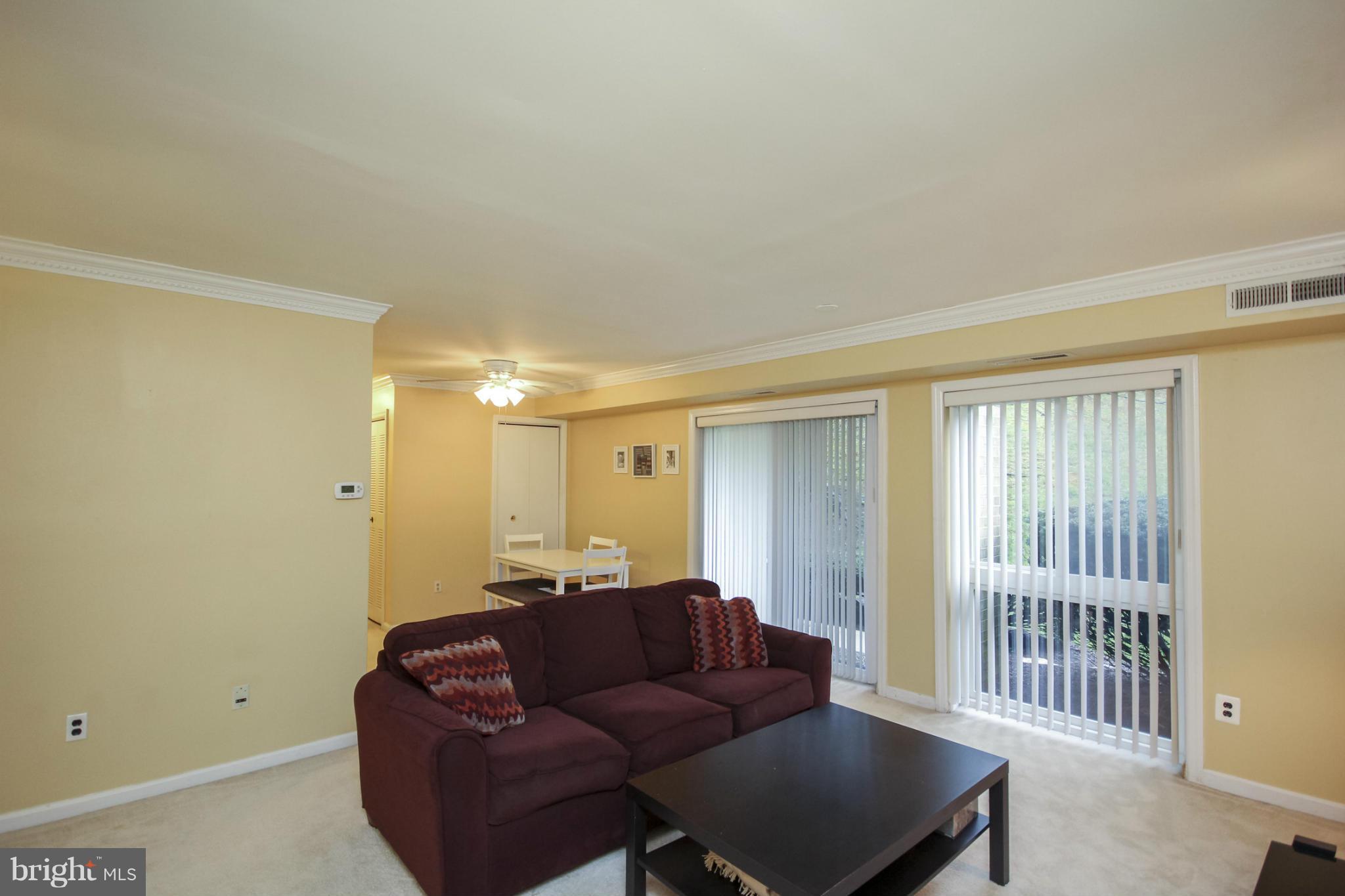 6155 Edsall Road, Unit 6155 Alexandria, VA 22304 - Photo 9 of 29 a living room with furniture and a window