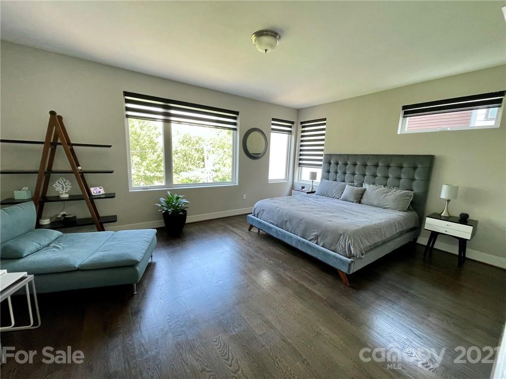 936 Westbrook Drive, Unit A Charlotte, NC 28202 - Photo 17 of 32 a bedroom with a bed window and couch