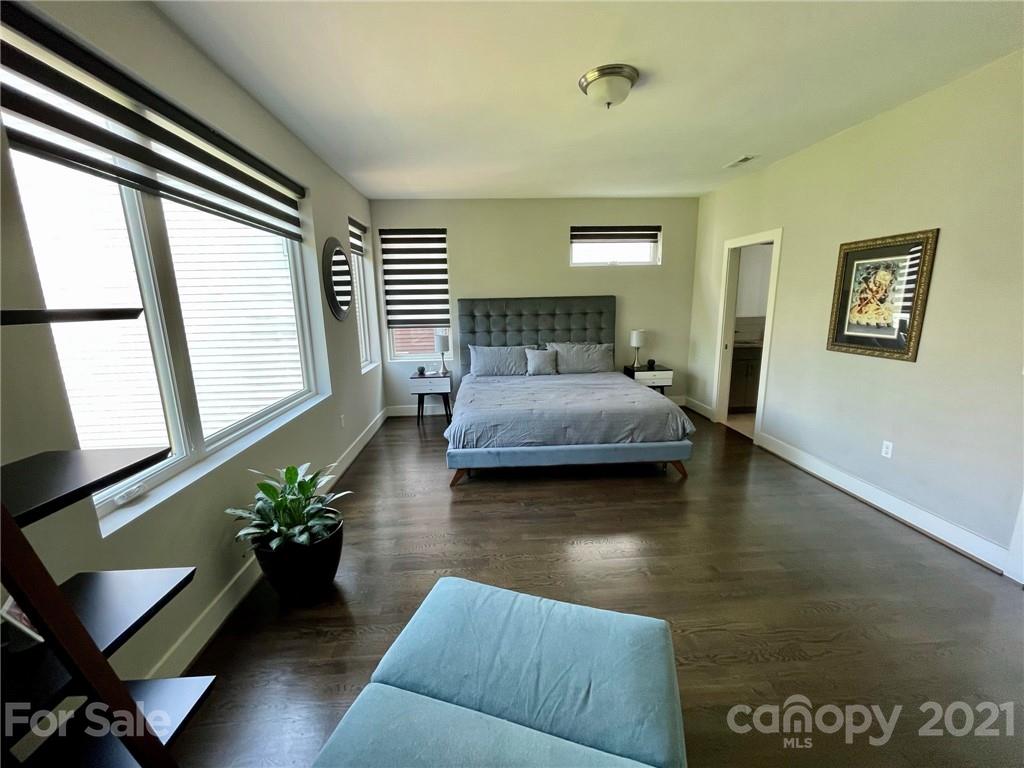 936 Westbrook Drive, Unit A Charlotte, NC 28202 - Photo 18 of 32 a bedroom with a bed window and couch