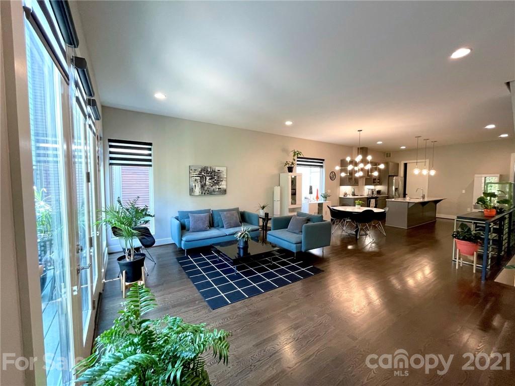 936 Westbrook Drive, Unit A Charlotte, NC 28202 - Photo 2 of 32 a living room with furniture and a view of kitchen