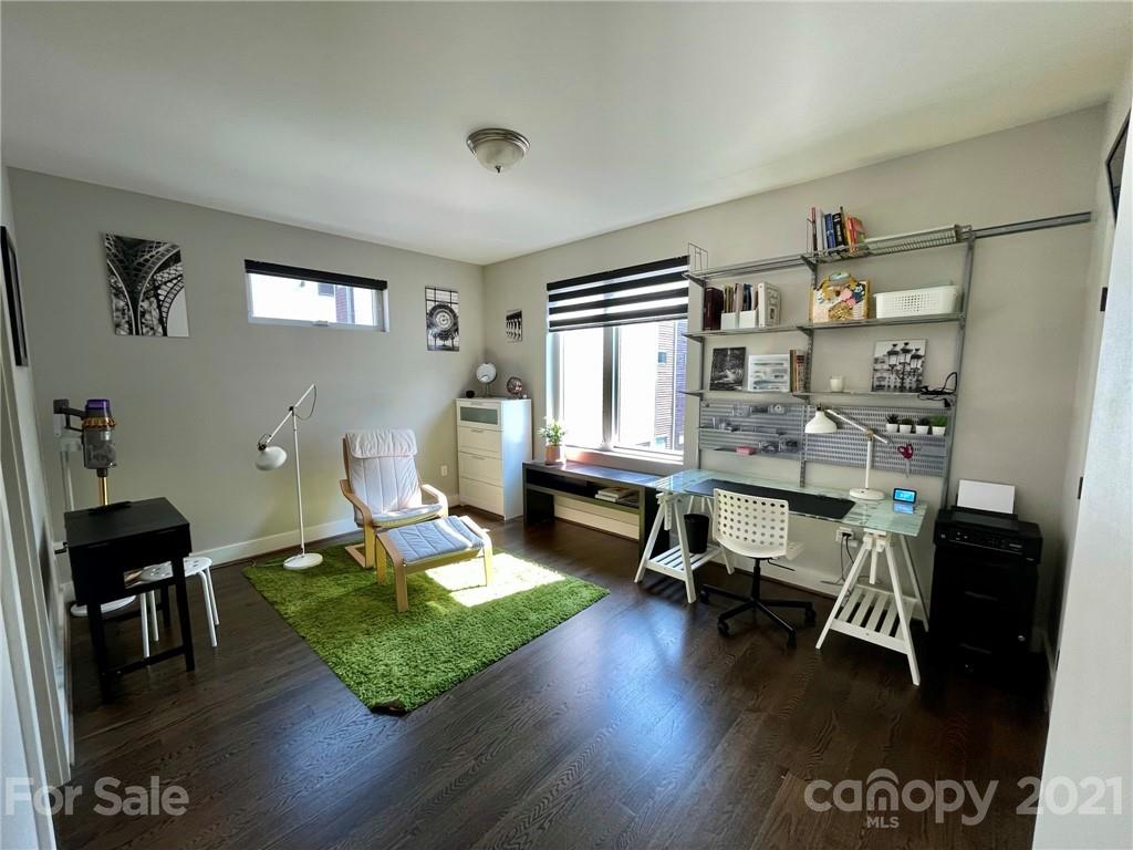 936 Westbrook Drive, Unit A Charlotte, NC 28202 - Photo 22 of 32 a living room with furniture and a wooden floor