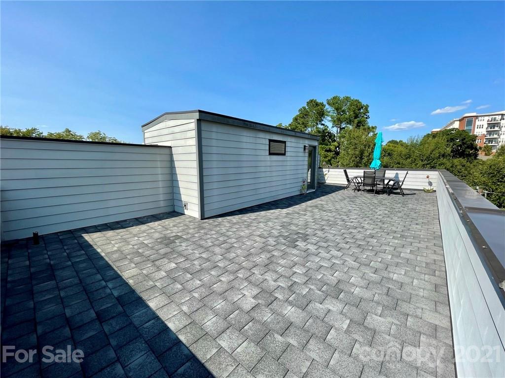 936 Westbrook Drive, Unit A Charlotte, NC 28202 - Photo 25 of 32 a backyard of a house with seating space