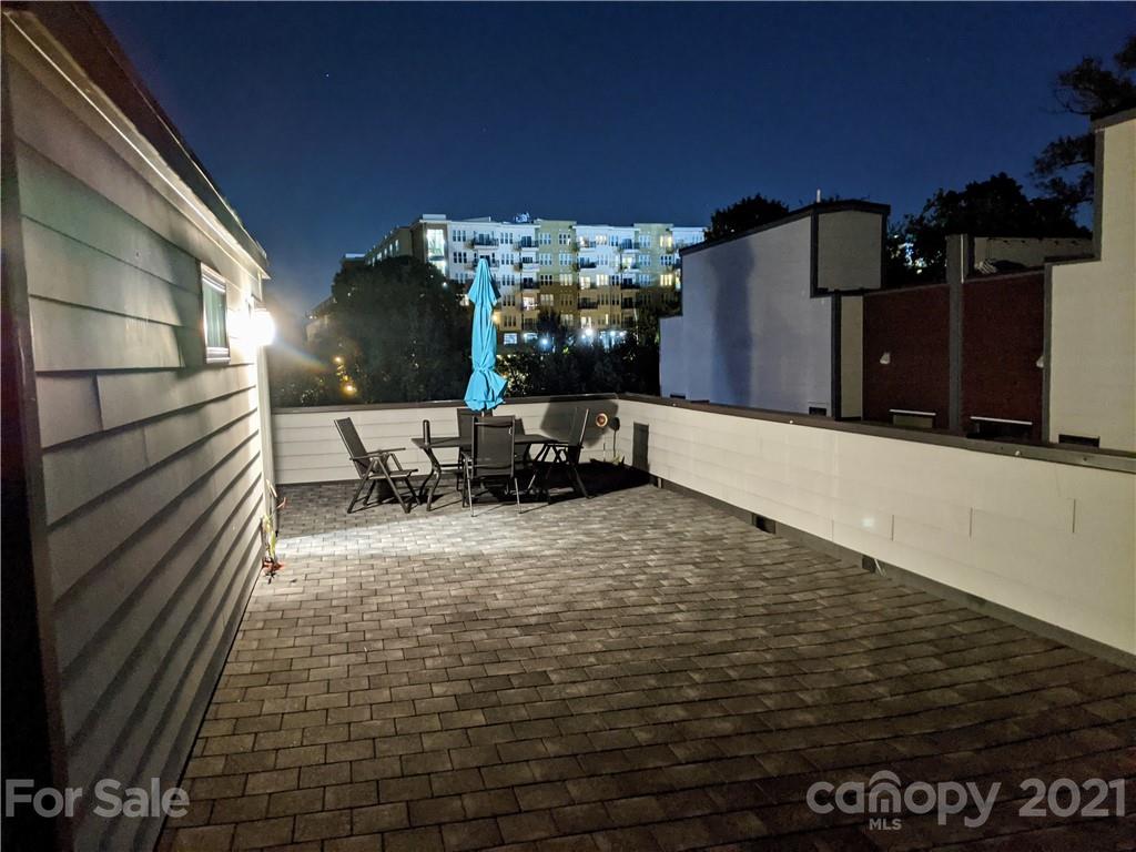 936 Westbrook Drive, Unit A Charlotte, NC 28202 - Photo 28 of 32 a view of a terrace with chairs