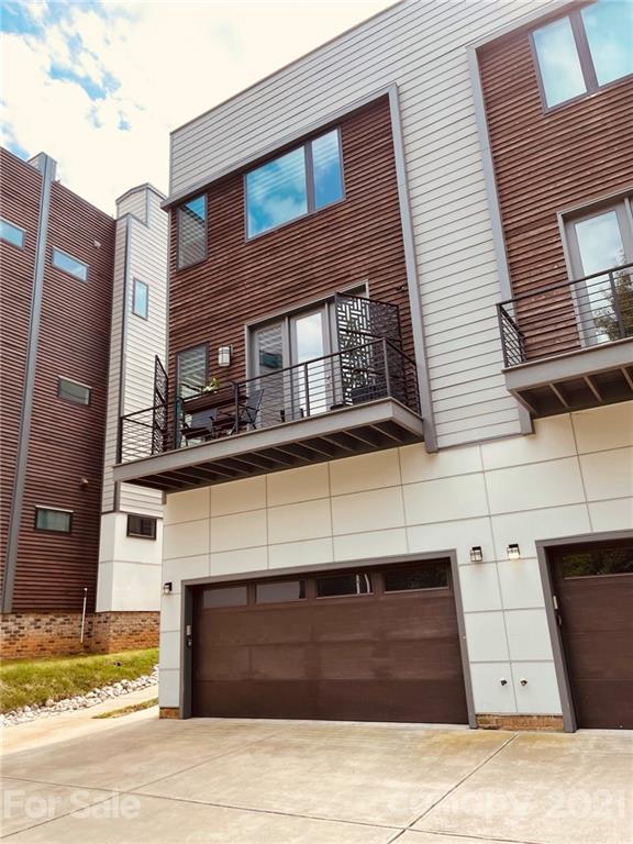 936 Westbrook Drive, Unit A Charlotte, NC 28202 - Photo 29 of 32 a front view of a house with a garage