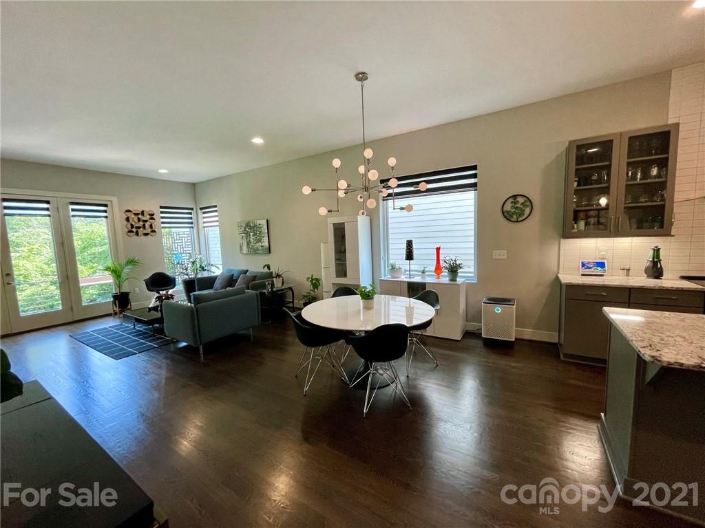 936 Westbrook Drive, Unit A Charlotte, NC 28202 - Photo 6 of 32 a living room with furniture and a large window