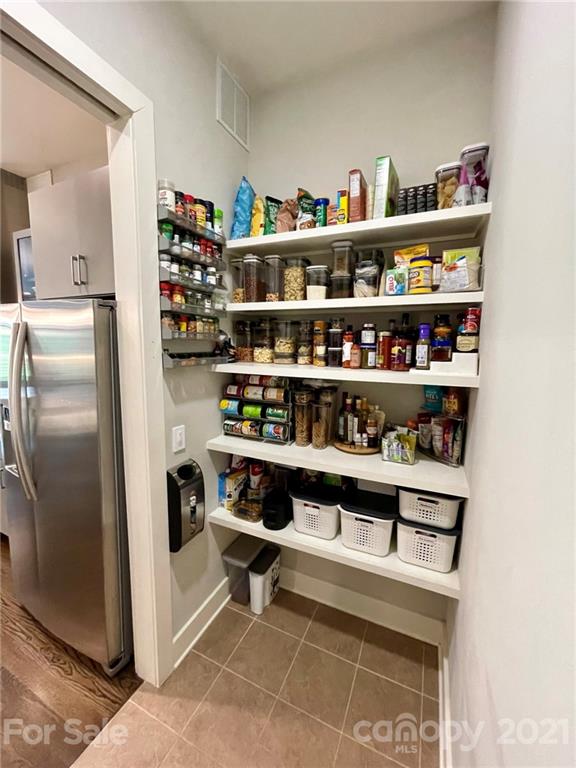 936 Westbrook Drive, Unit A Charlotte, NC 28202 - Photo 9 of 32 a room with a book shelf