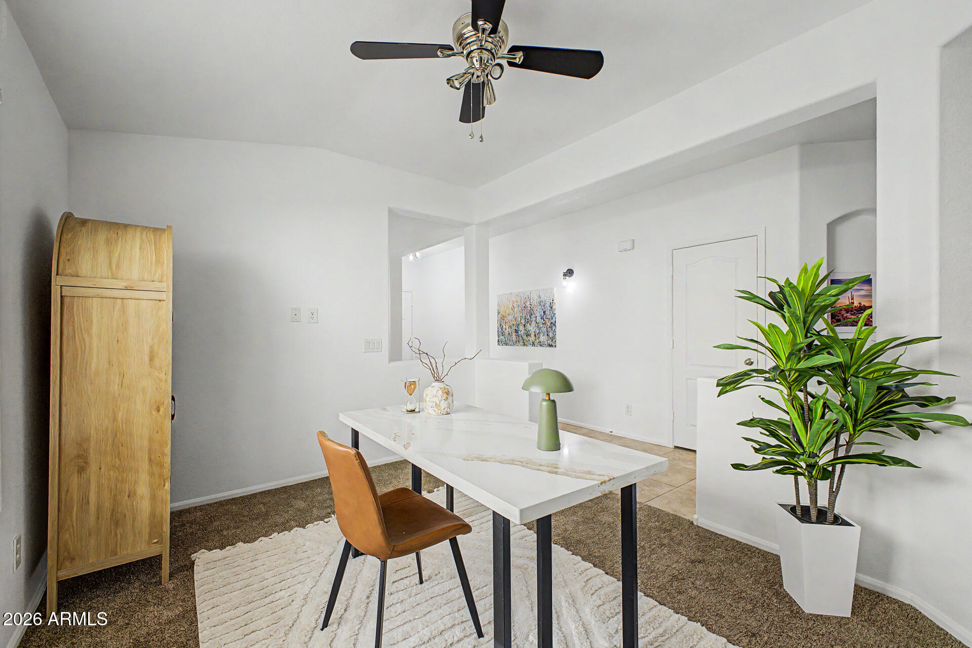 4168 East Sandy Way Gilbert, AZ 85297 - Photo 13 of 47 a view of a dining room with a table and chairs