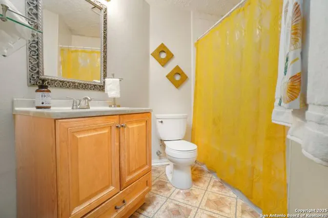 a bathroom with a sink and a toilet
