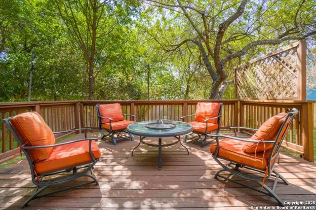 a backyard of a house with outdoor seating