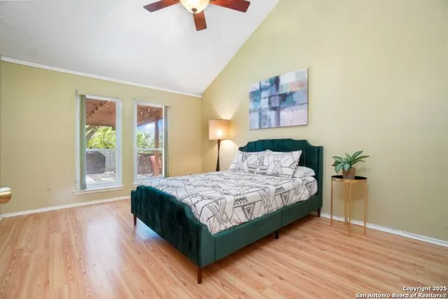 a bedroom with a large bed and a window