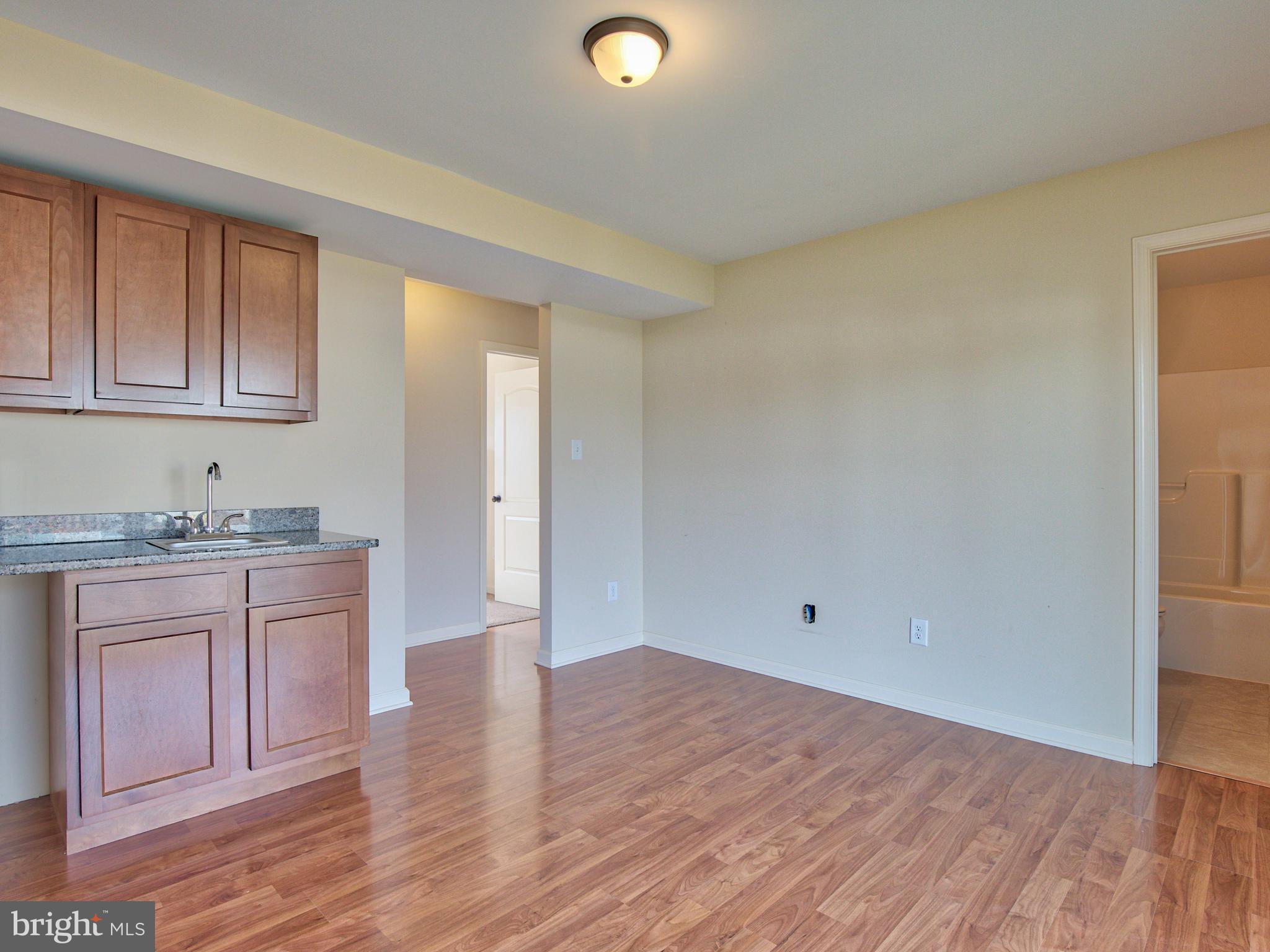 125 Job Road Inwood, WV 25428 - Photo 25 of 32 Lower level game/living room with wetbar!