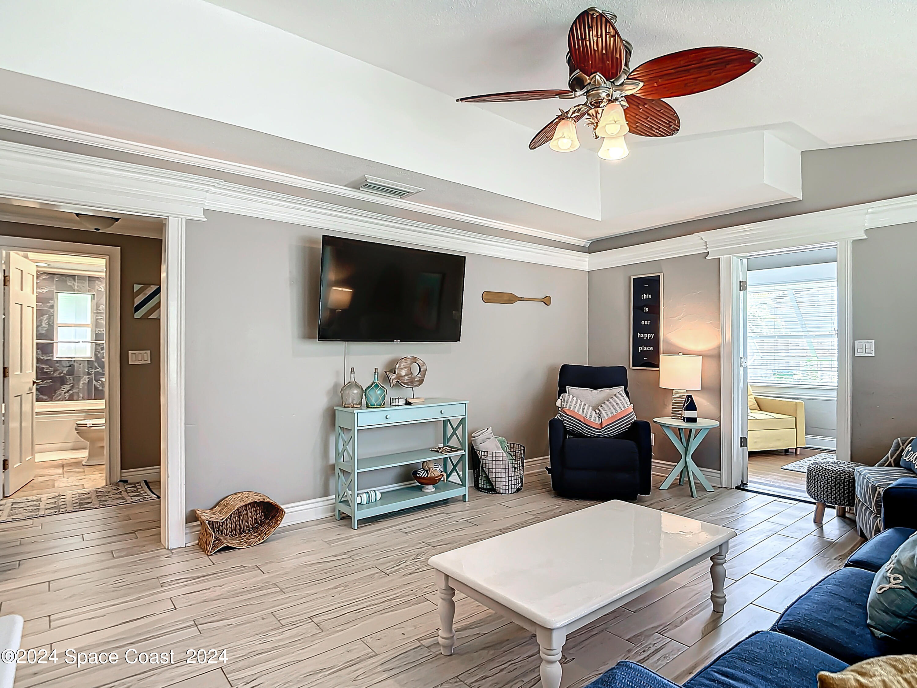230 Rita Boulevard Melbourne Beach, FL 32951 - Photo 14 of 36 a living room with furniture and a flat screen tv