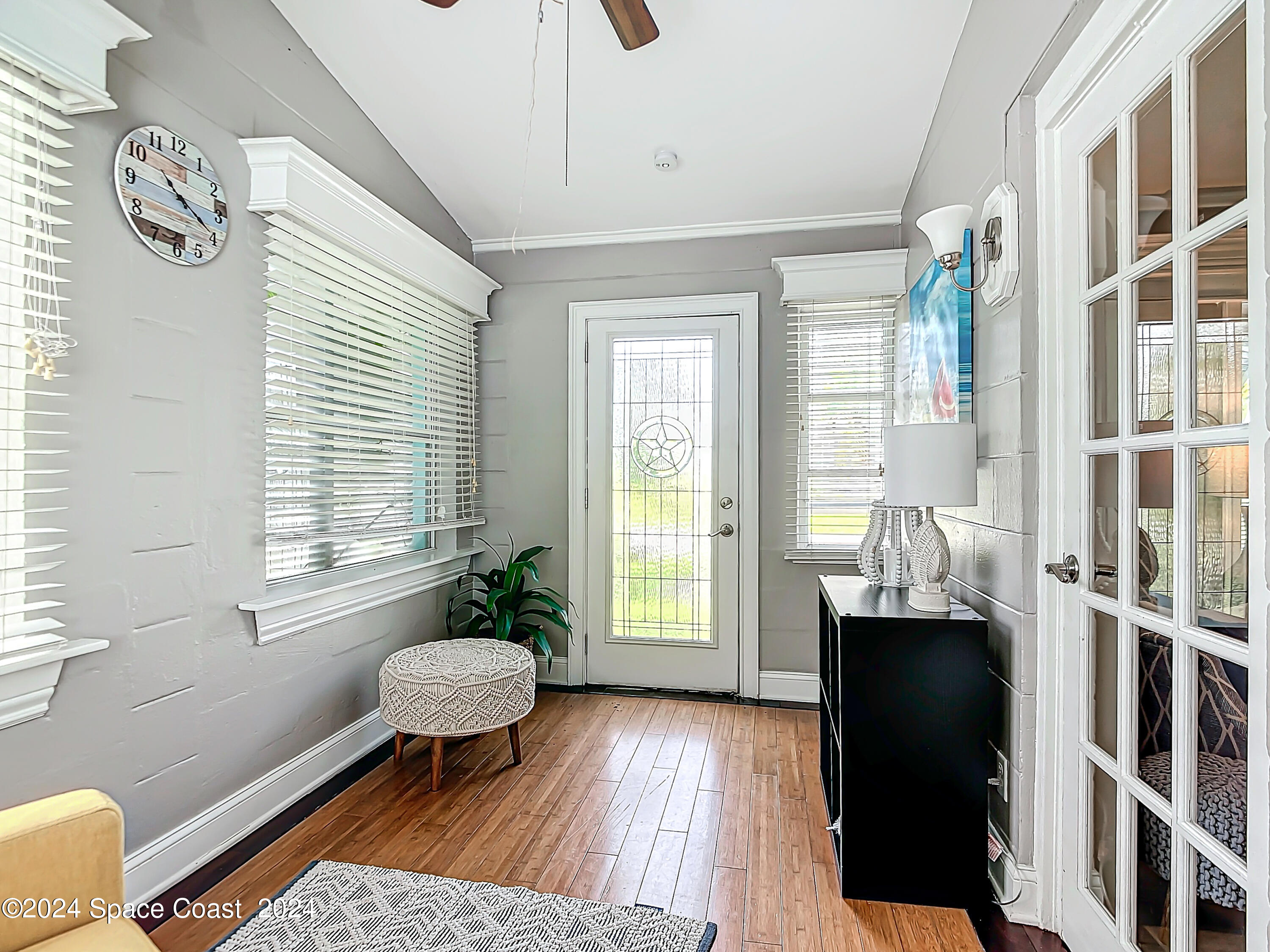 230 Rita Boulevard Melbourne Beach, FL 32951 - Photo 17 of 36 a living room with furniture and a window