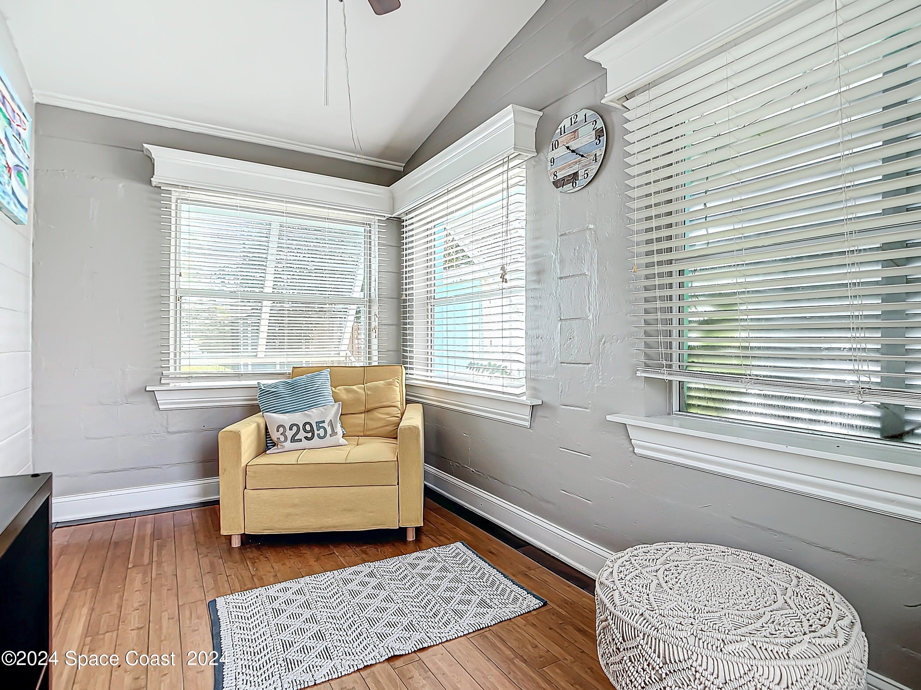 230 Rita Boulevard Melbourne Beach, FL 32951 - Photo 18 of 36 a living room with furniture and a window