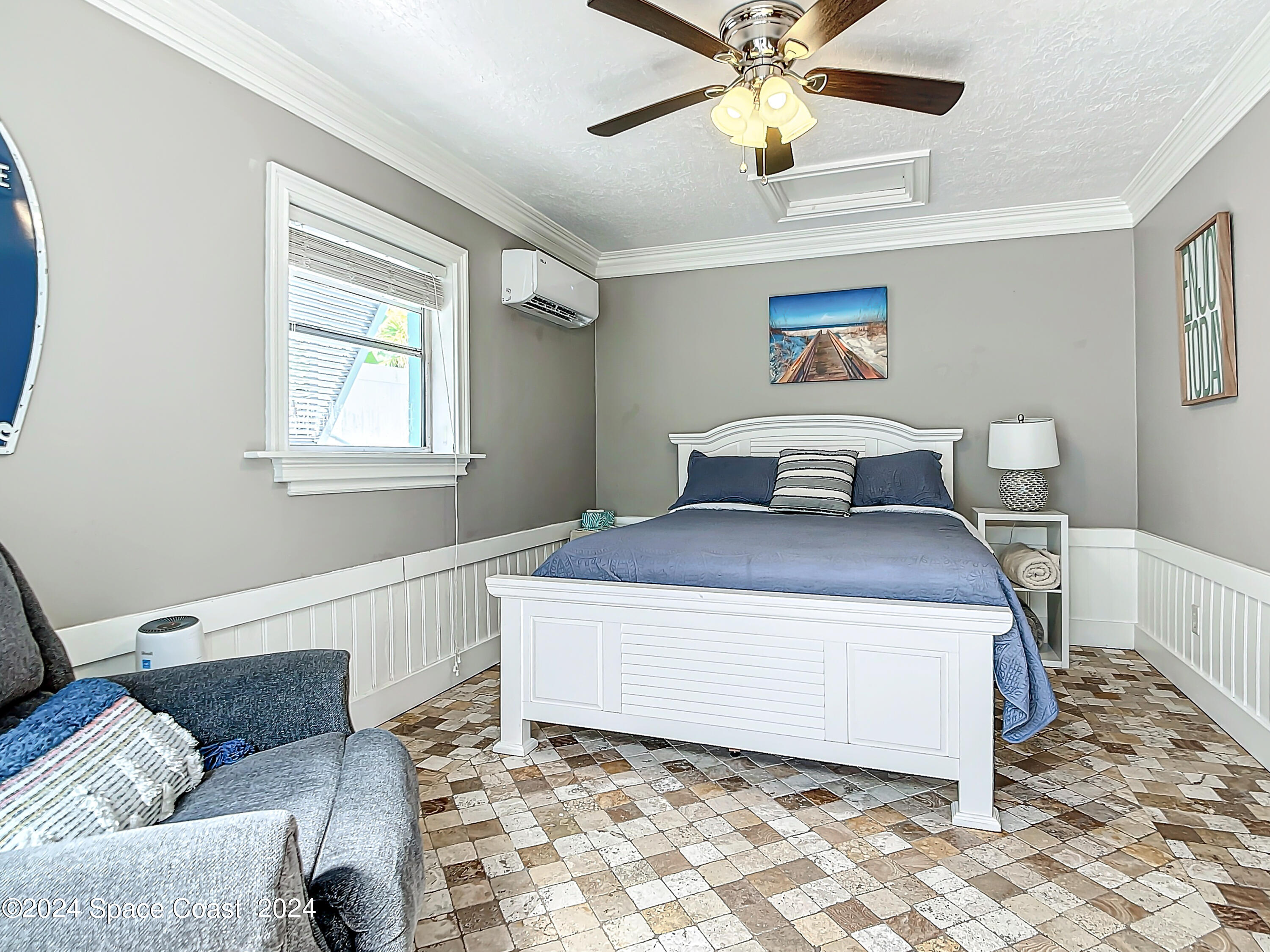 230 Rita Boulevard Melbourne Beach, FL 32951 - Photo 20 of 36 a bedroom with a bed and window