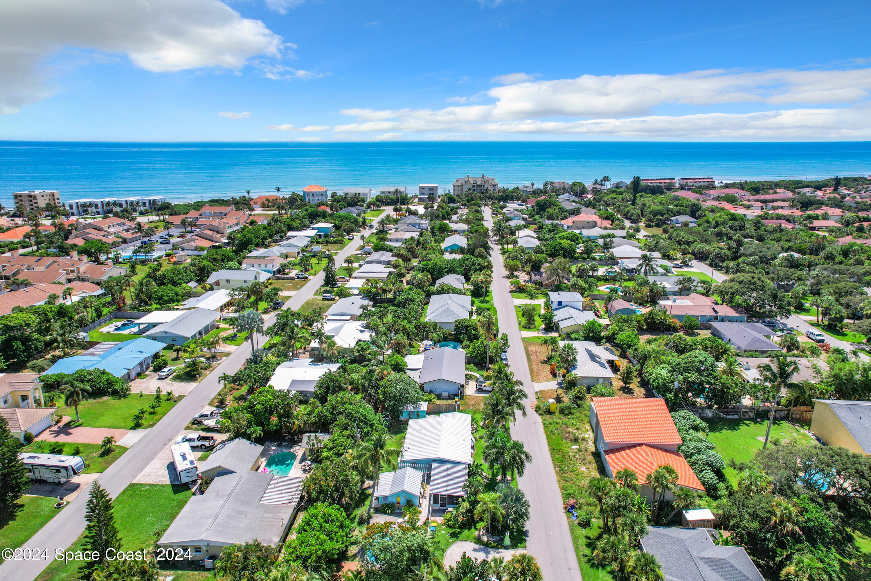 230 Rita Boulevard Melbourne Beach, FL 32951 - Photo 2 of 36 an aerial view of residential building and lake