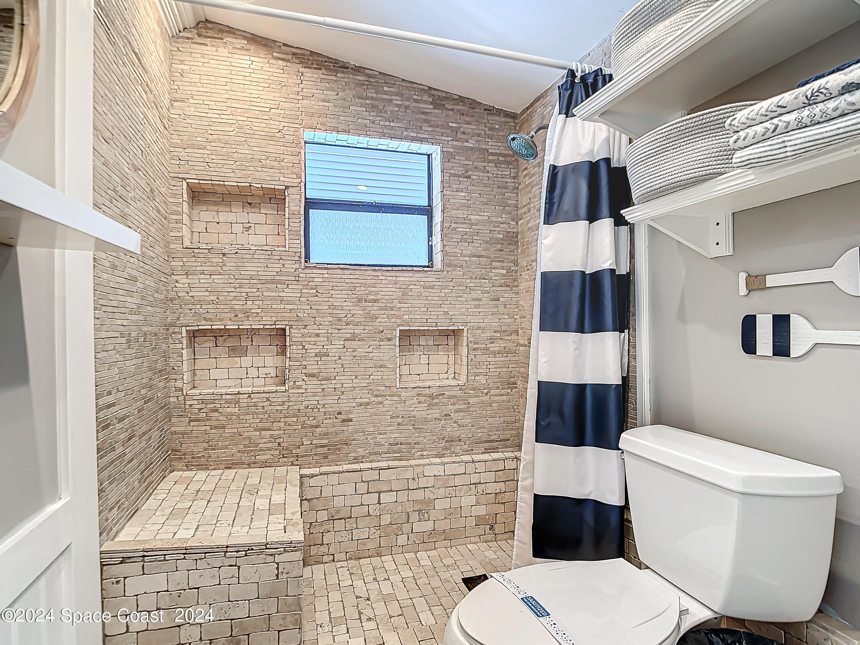 230 Rita Boulevard Melbourne Beach, FL 32951 - Photo 25 of 36 a bathroom with a toilet and a shower