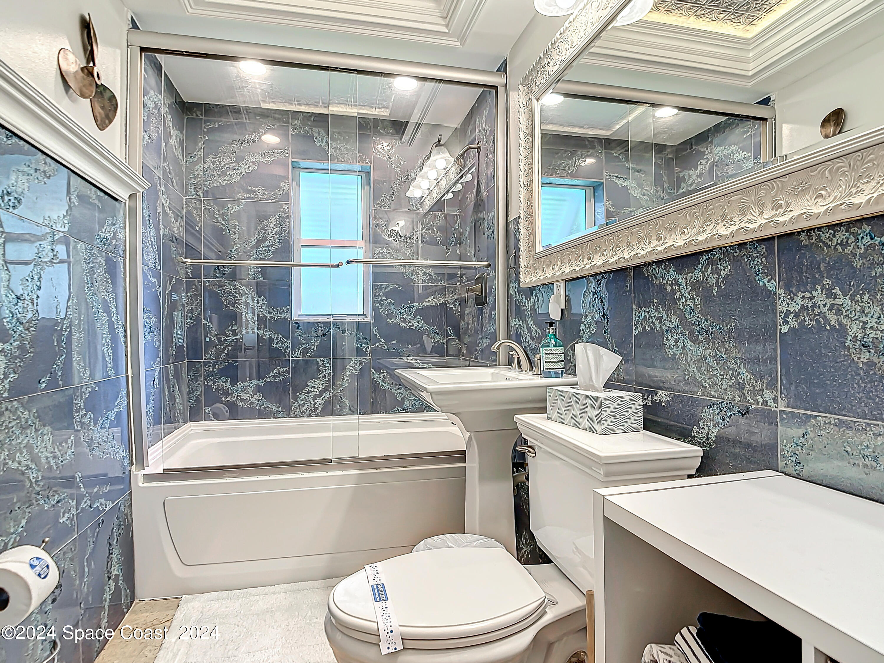 230 Rita Boulevard Melbourne Beach, FL 32951 - Photo 27 of 36 a bathroom with a toilet a sink and a shower