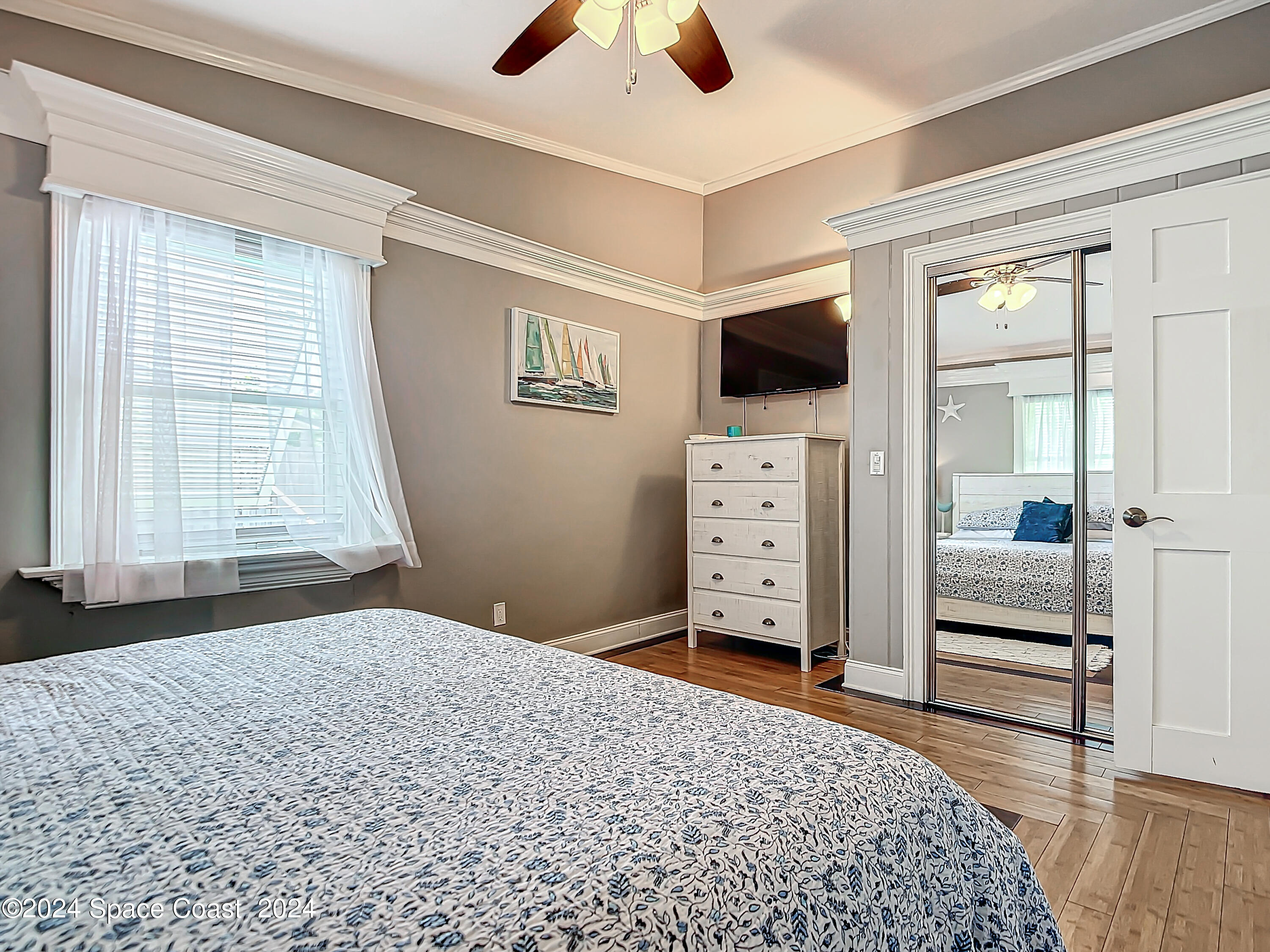 230 Rita Boulevard Melbourne Beach, FL 32951 - Photo 28 of 36 a bedroom with a bed and a television