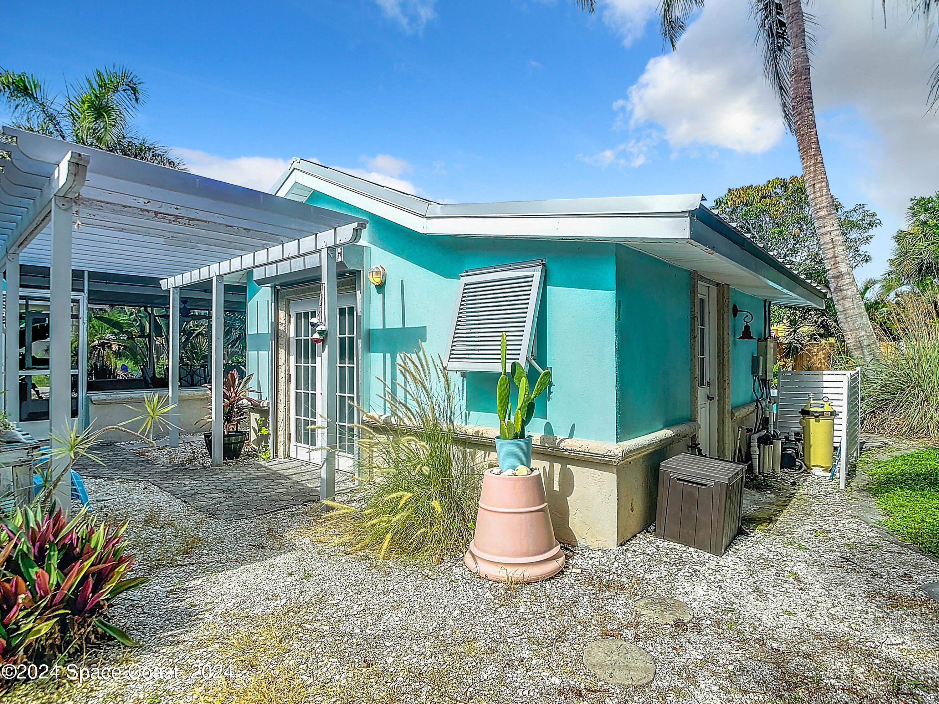 230 Rita Boulevard Melbourne Beach, FL 32951 - Photo 33 of 36 a house view with a seating space