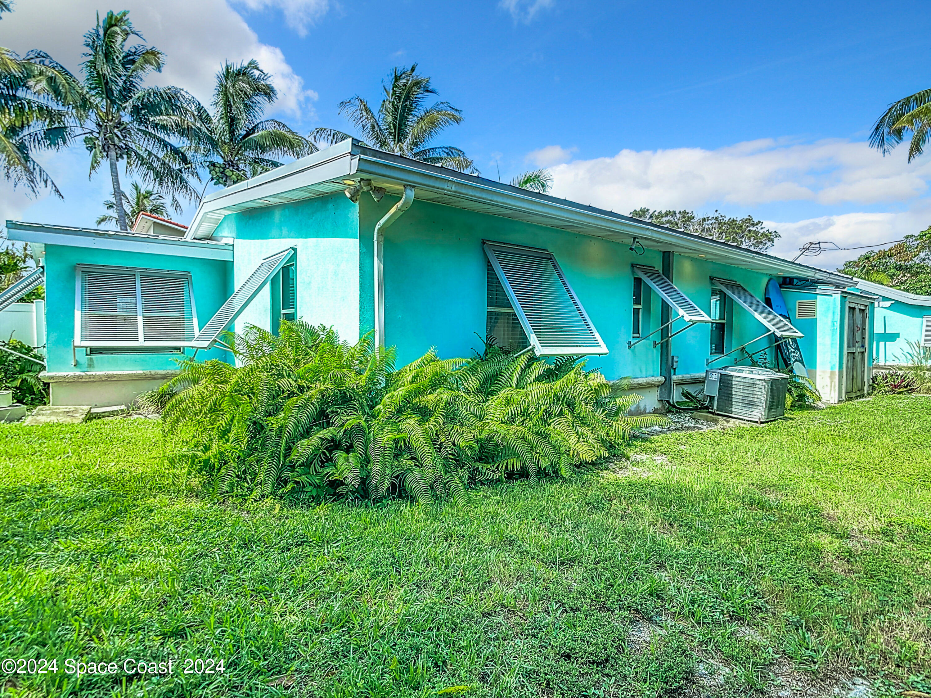 230 Rita Boulevard Melbourne Beach, FL 32951 - Photo 34 of 36 a view of a house with a yard