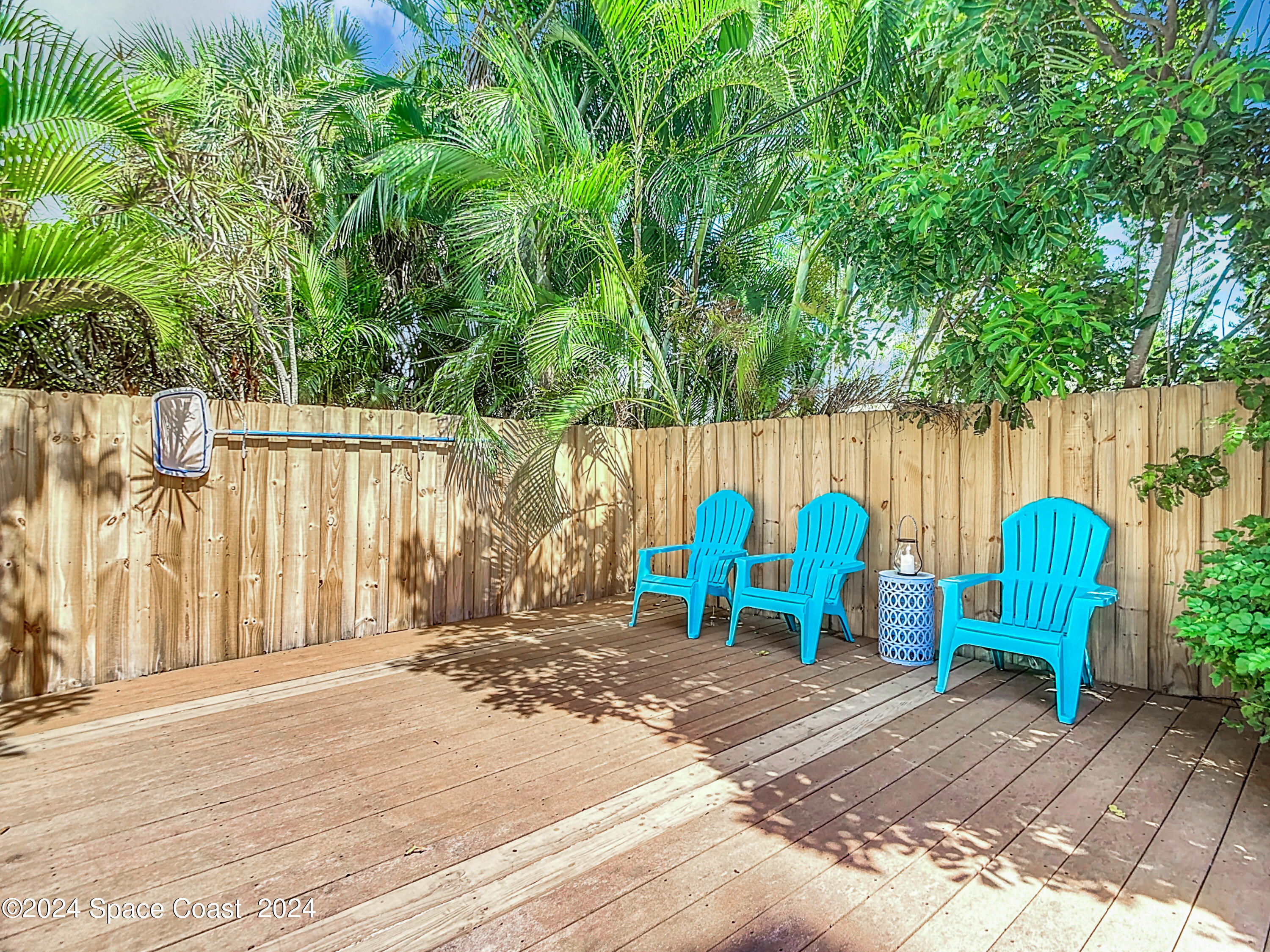 230 Rita Boulevard Melbourne Beach, FL 32951 - Photo 35 of 36 a view of a bench with wooden fence