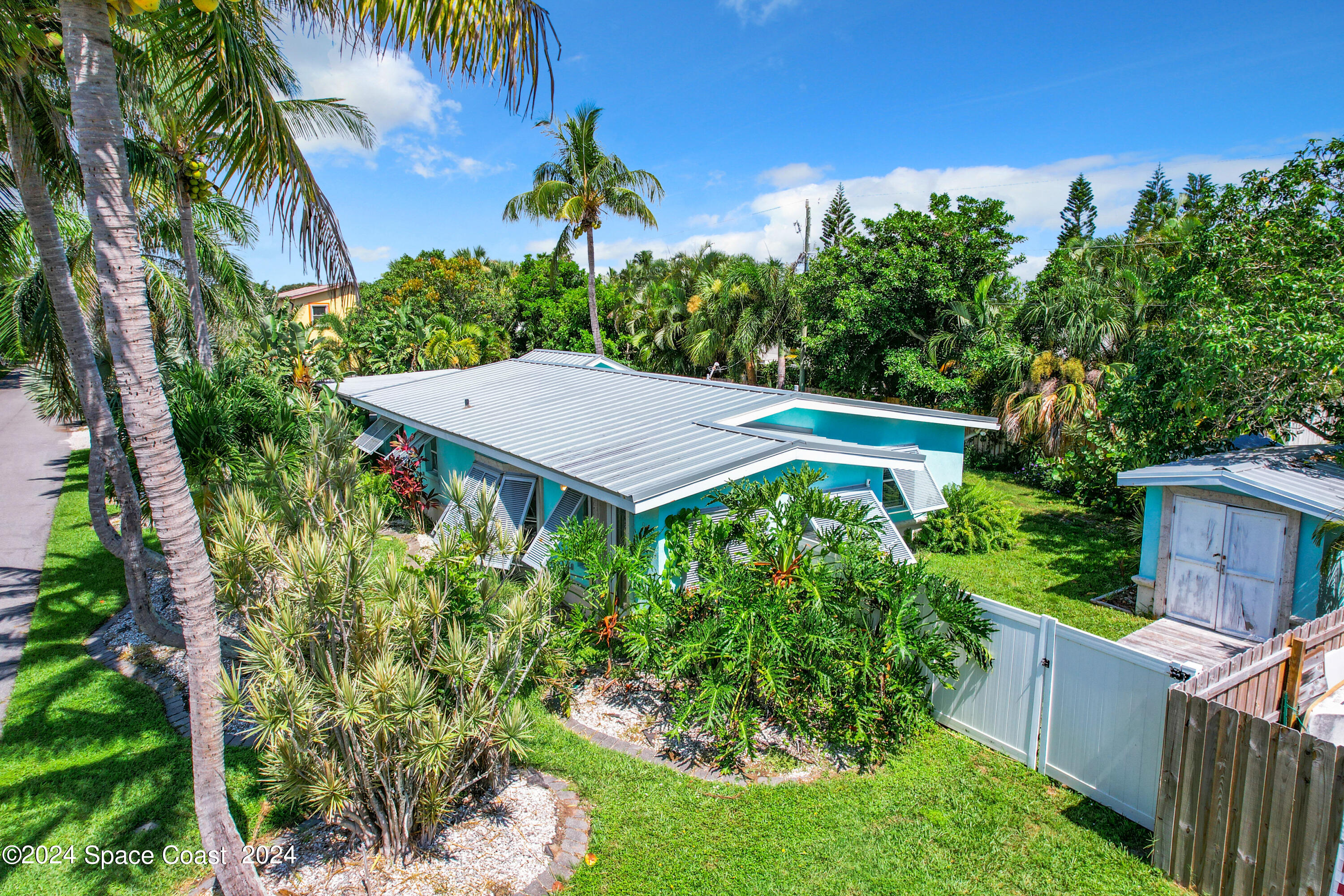 230 Rita Boulevard Melbourne Beach, FL 32951 - Photo 4 of 36 a view of a backyard with plants