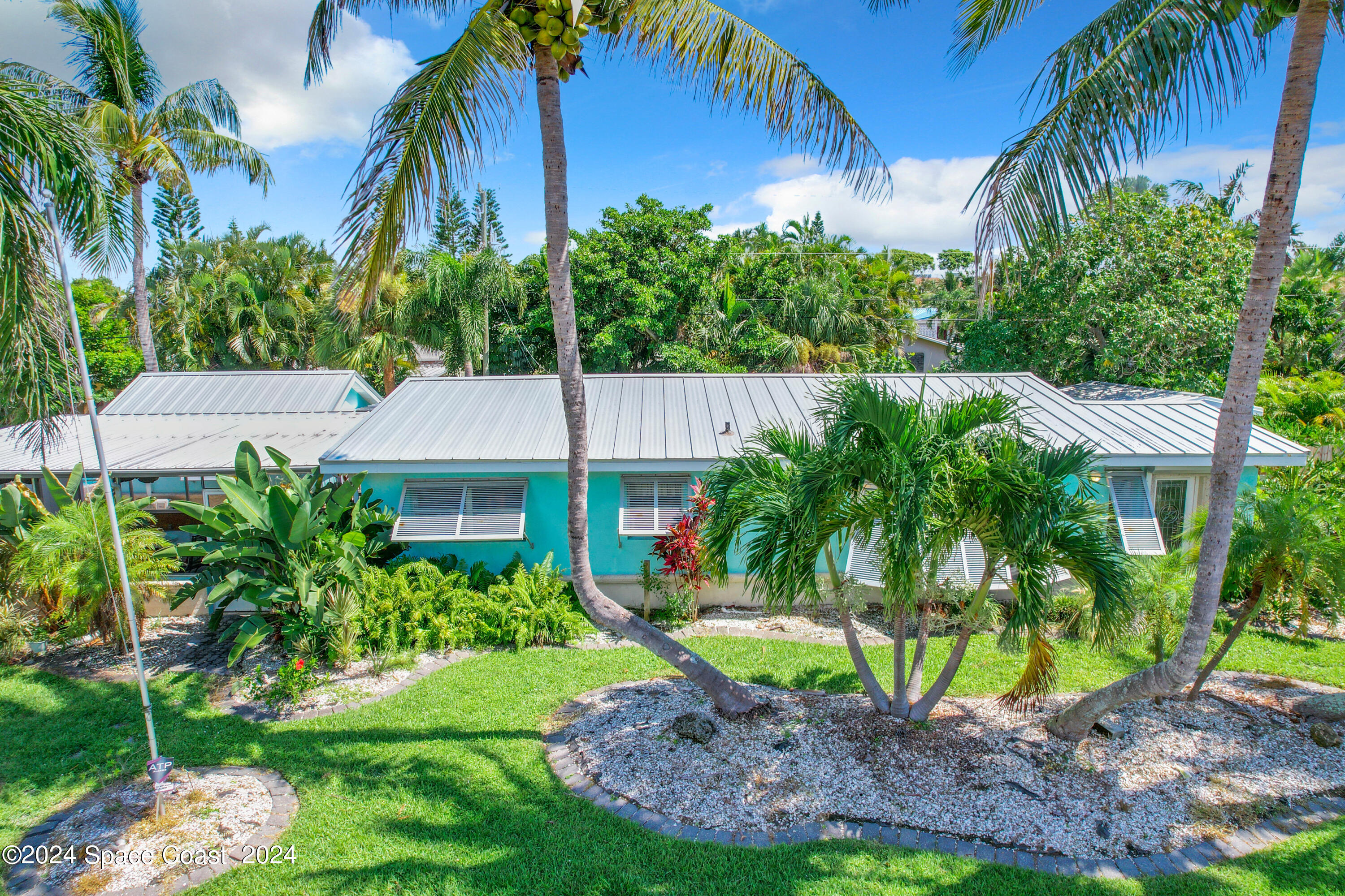 230 Rita Boulevard Melbourne Beach, FL 32951 - Photo 5 of 36 a house view with a garden space