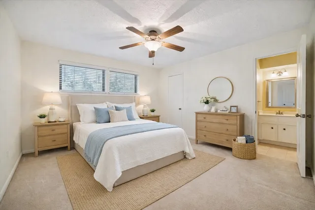 a bathroom with double vanity sink and mirror