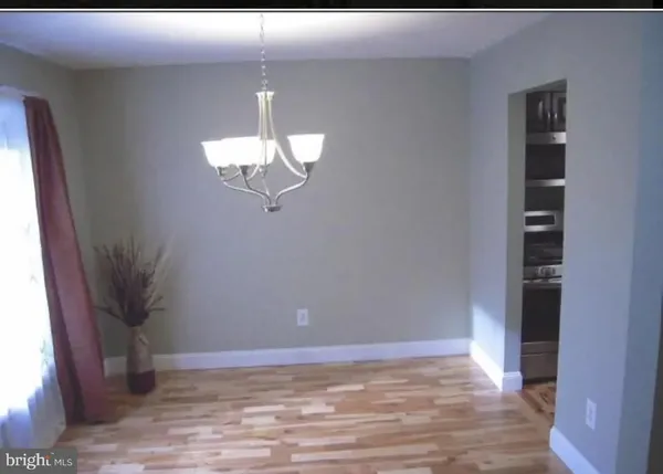 a view of a livingroom with wooden floor