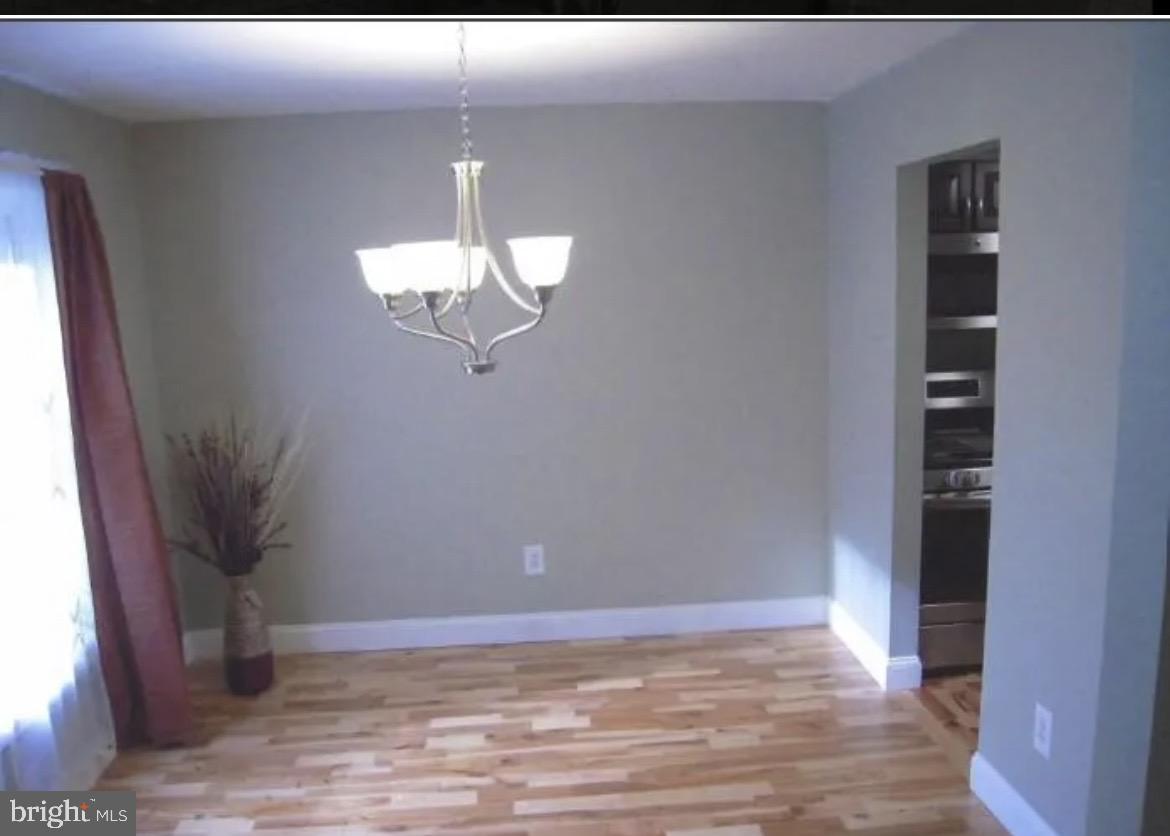 3 Strabane Court Parkville, MD 21234 - Photo 2 of 12 a view of a livingroom with wooden floor